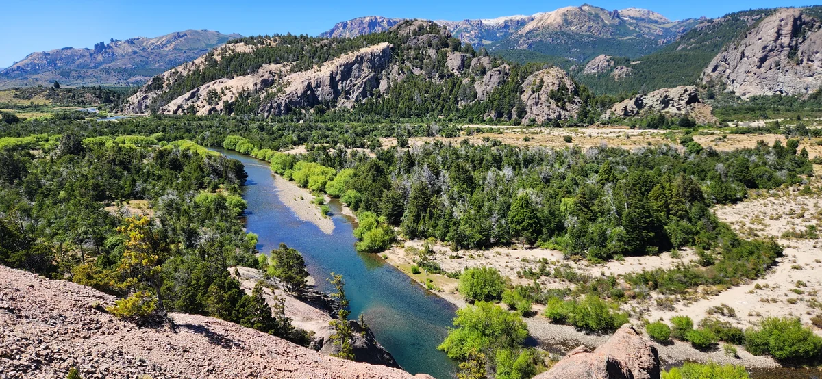 Traful River flowing through a mountain valley, a famous fly fishing destination in Patagonia