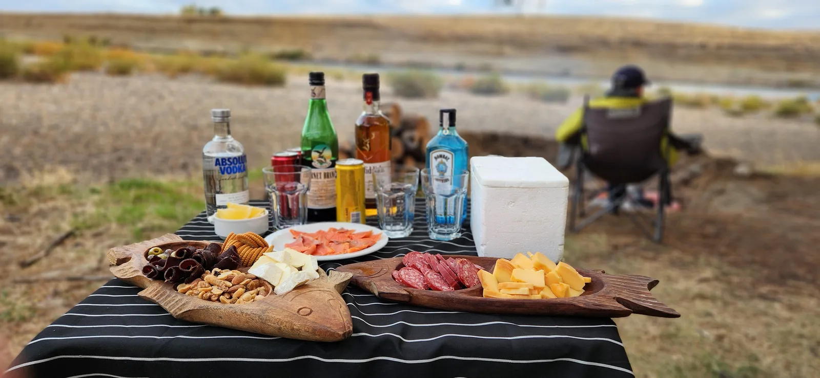 Patagonian appetizer and drinks at a riverside fly fishing camp