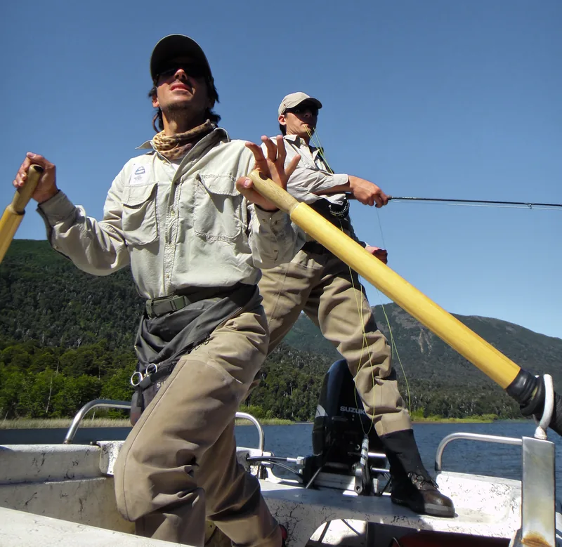Southern Rivers fly fishing guides rowing and casting from a boat near Bariloche, Patagonia