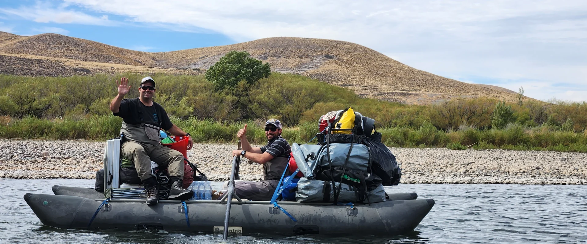 Camp assistant navigating the cargo boat during a Caleufu River fly fishing expedition
